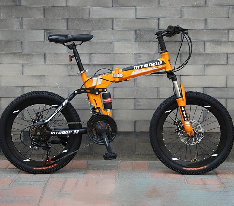 Rider using a China-made folding bike on a city street